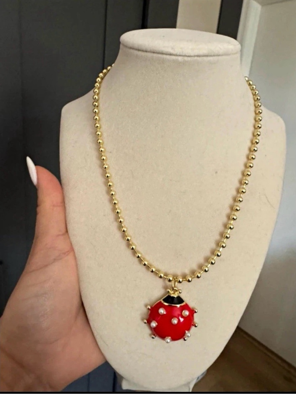 Gold Beaded Necklace with Red Ladybug Pendant